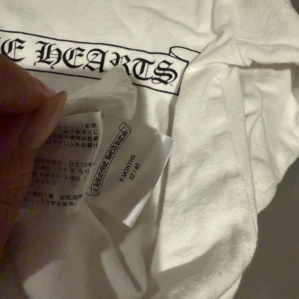 White long sleeve baby chrome heats tee. 6m runs big